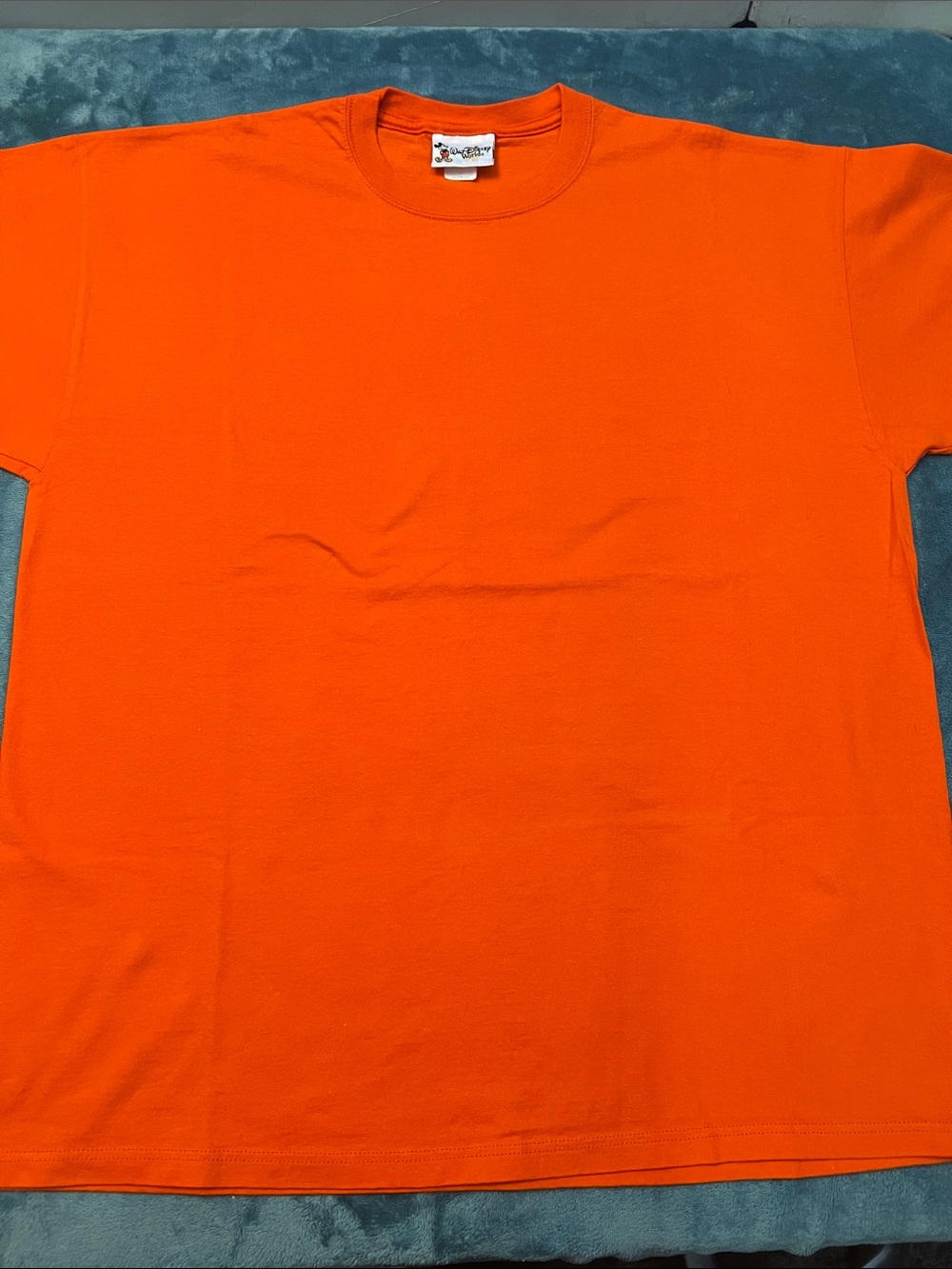 Disney Orange plain good condition size large Tee